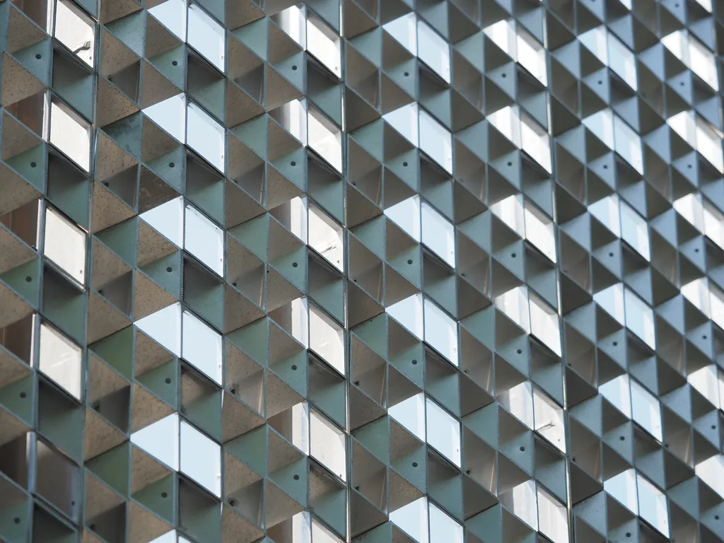 a wall made out of square metal tubes