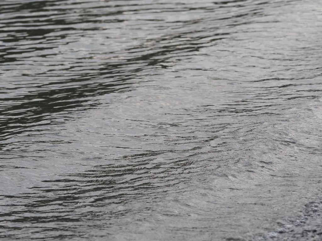 a boat's wake on a river