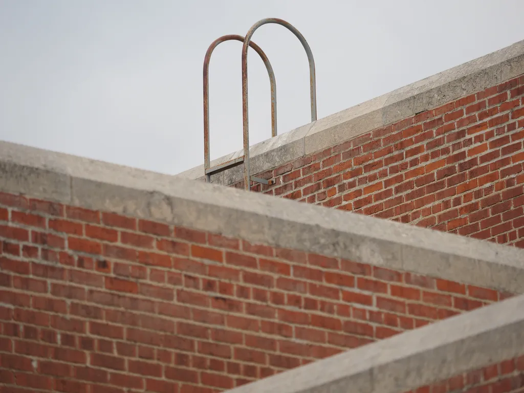 three levels of red brick wall