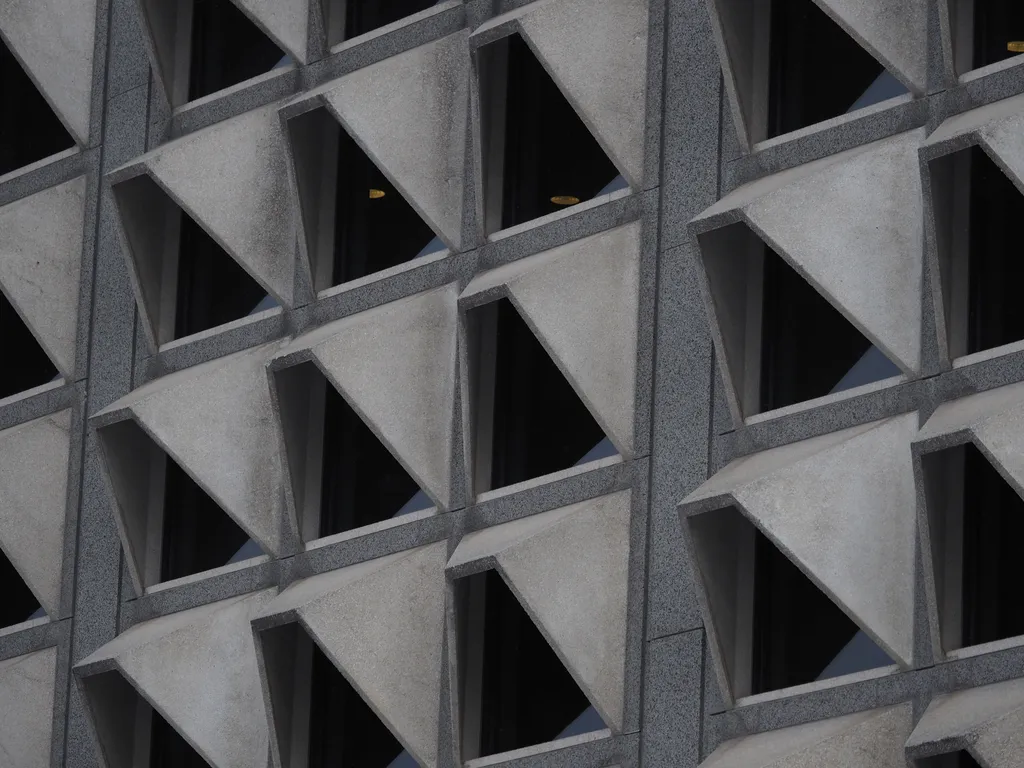 slanted concrete awnings on a large building