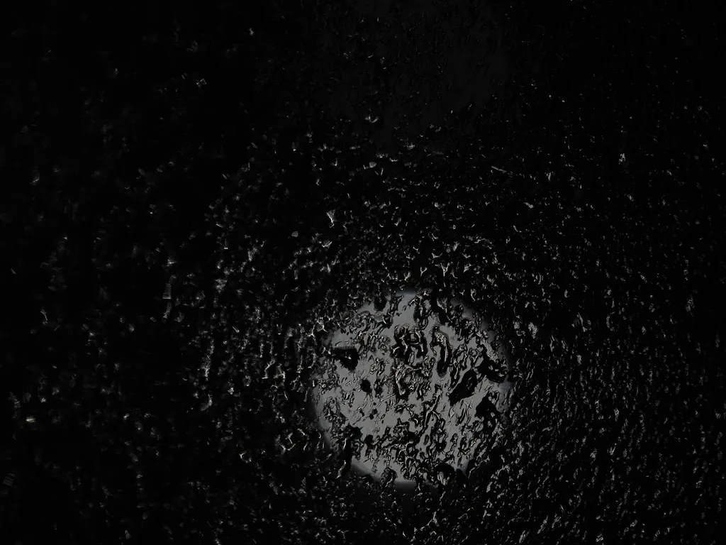 water droplets on a window at night