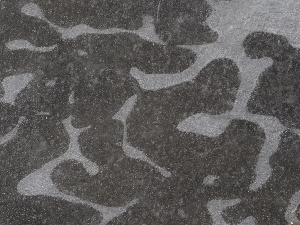 bubbles under ice in a camouflage pattern