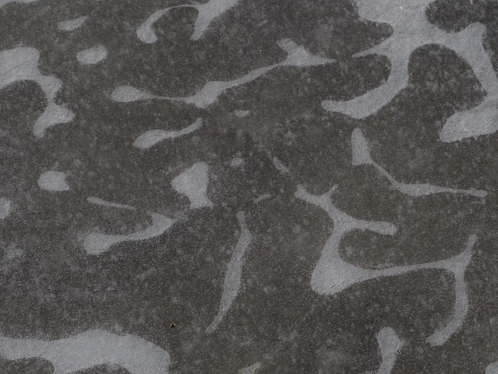 bubbles under ice in a camouflage pattern