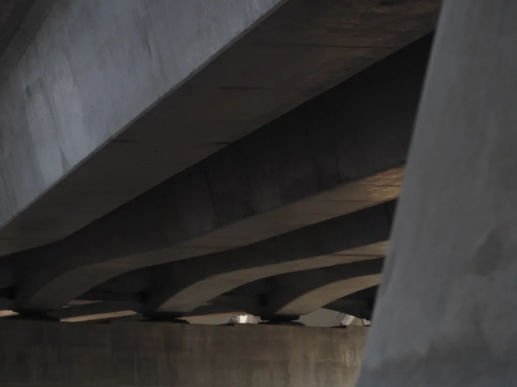 the concrete underside of a bridge