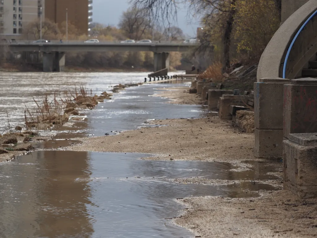 a flooded path along a river