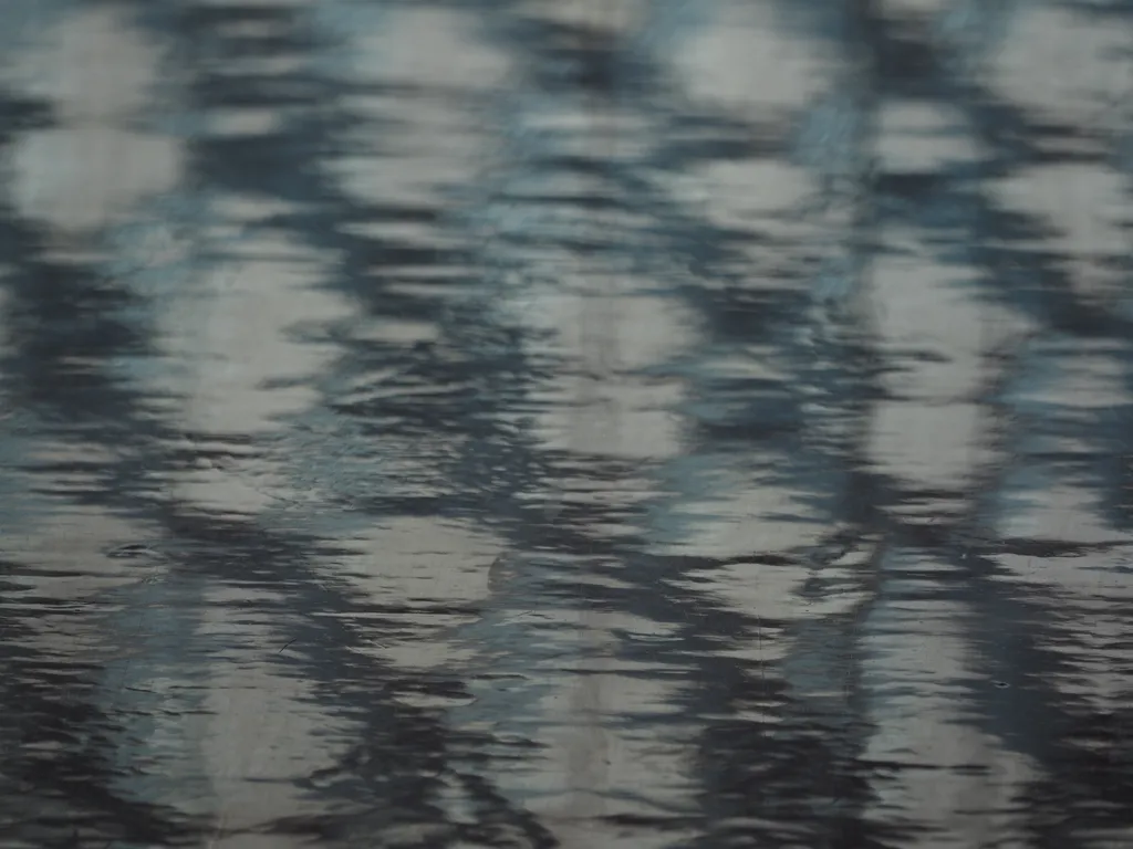 a diamond window reflected in a shiny floor