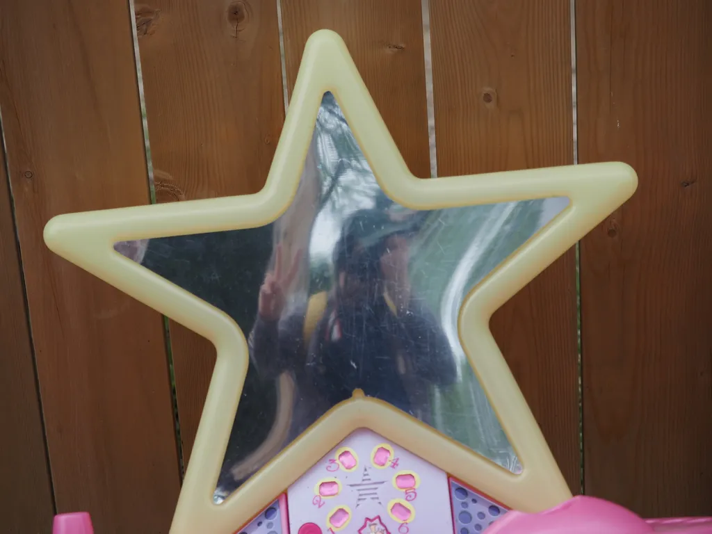 a selfie in a star-shaped children's vanity play set