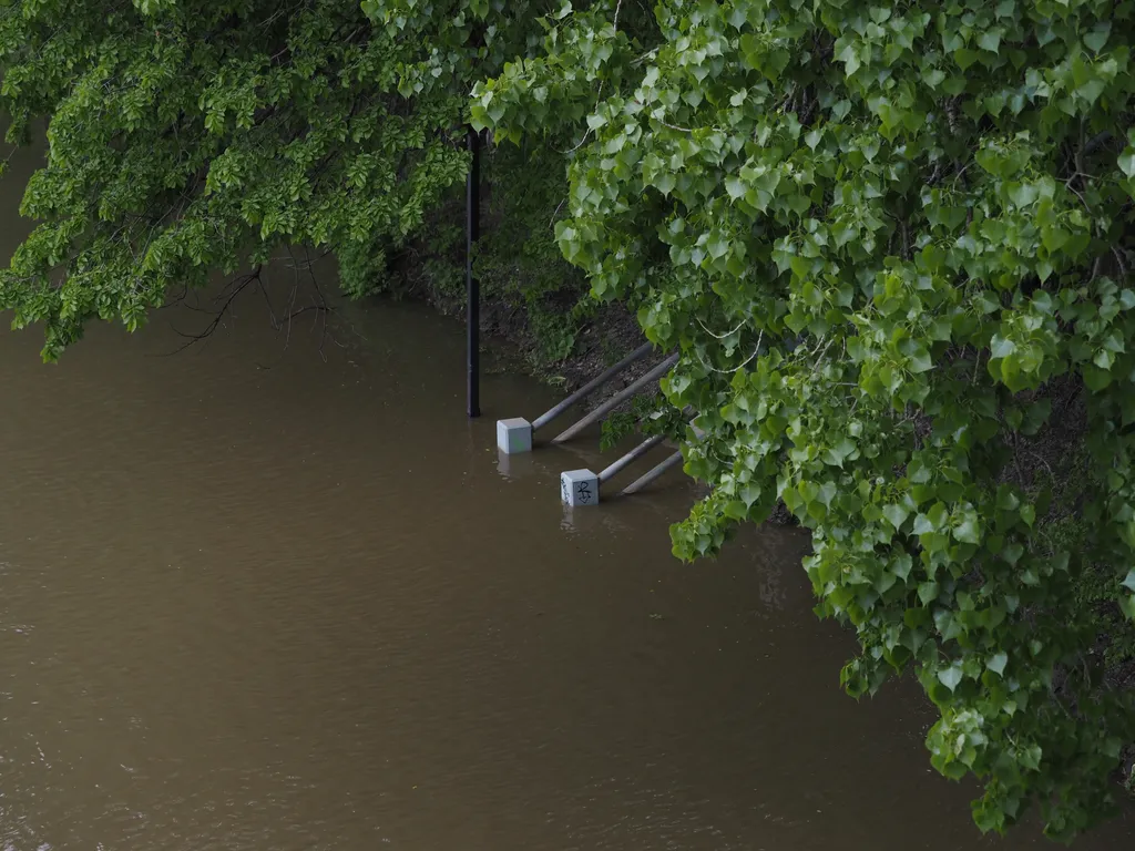 a set of stairs descending into a flooded river