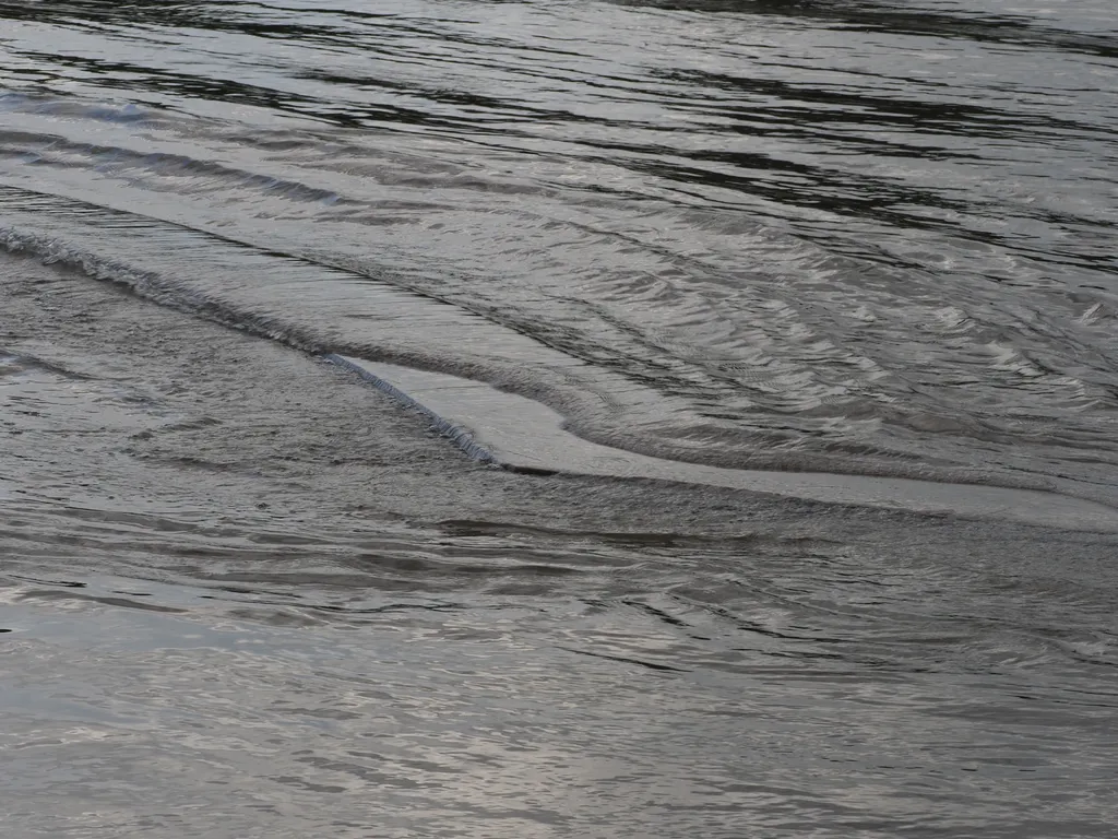 a stone platform surrounded by floodwater