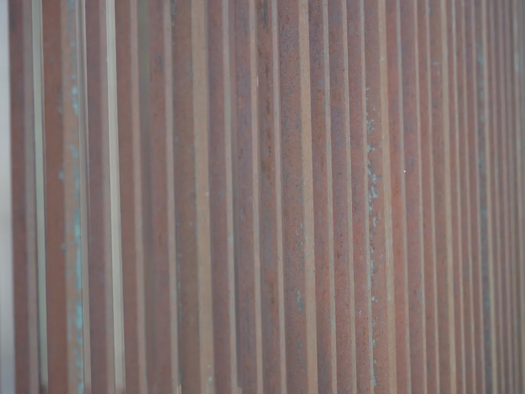 rusted metal bars of a gate