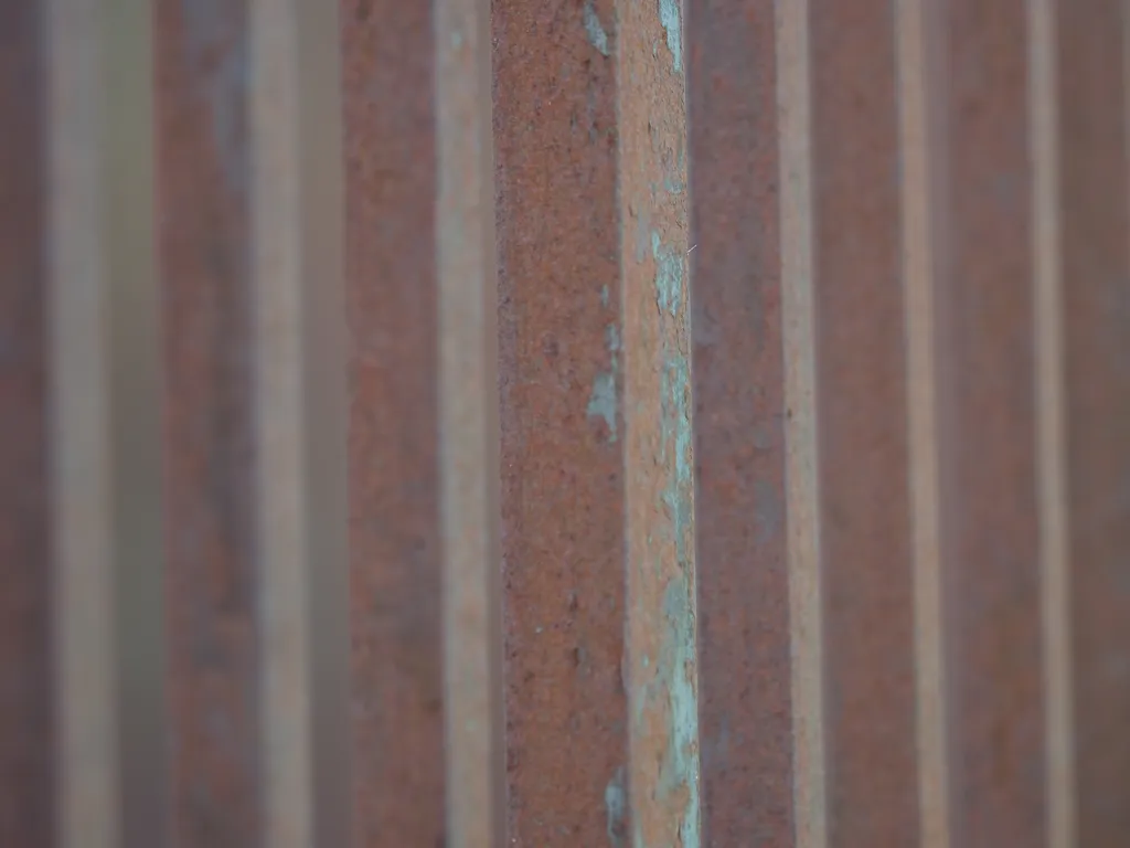 rusted metal bars of a gate