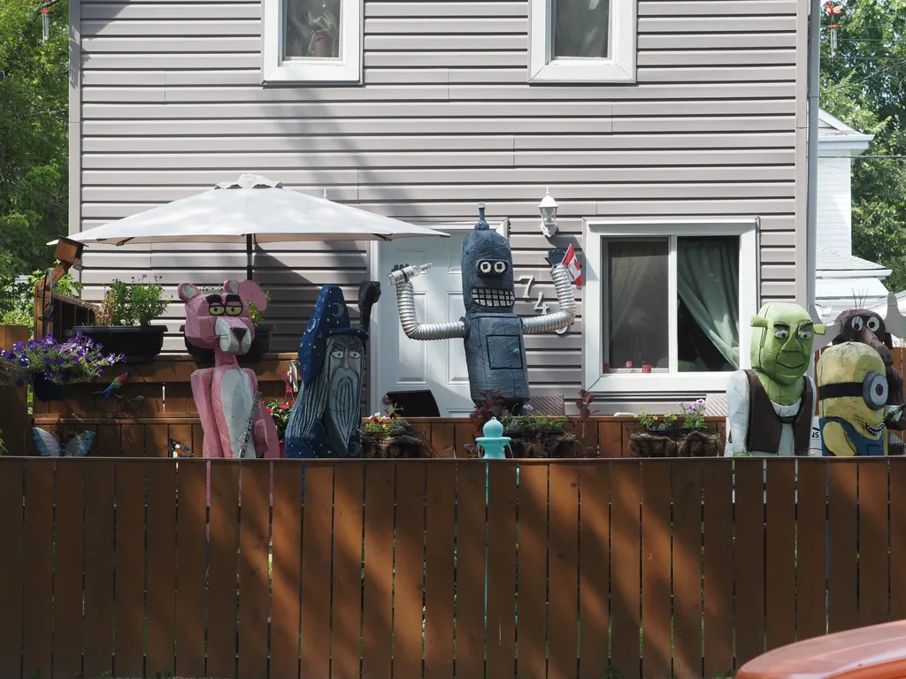 wooden sculptures of several cartoon characters (as well as a wizard and moose that may or may not be Bullwinkle)