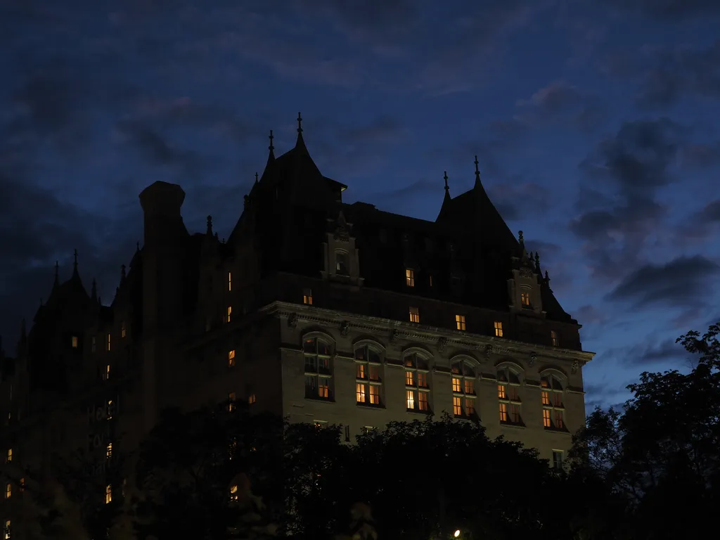 A hotel lit up at night