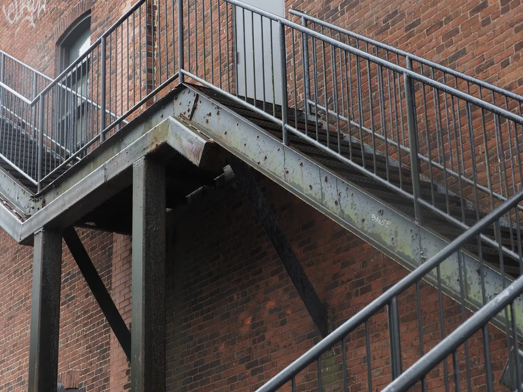 a metal fire escape outside a brick building