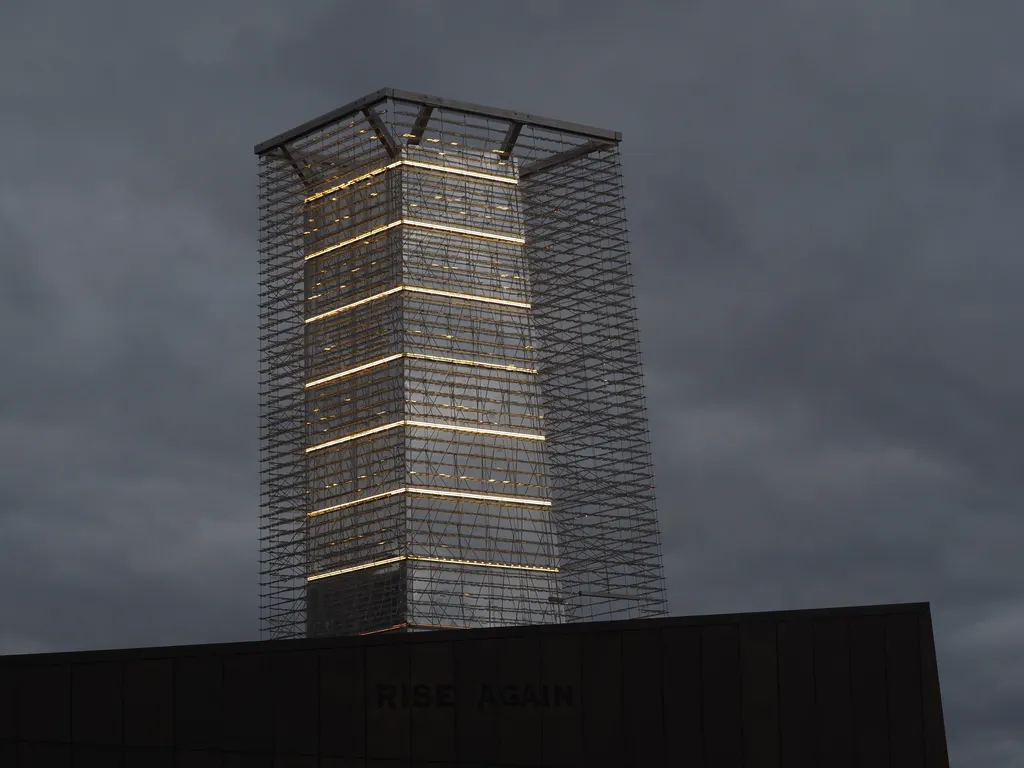 a kinetic sculpture on the roof of a building