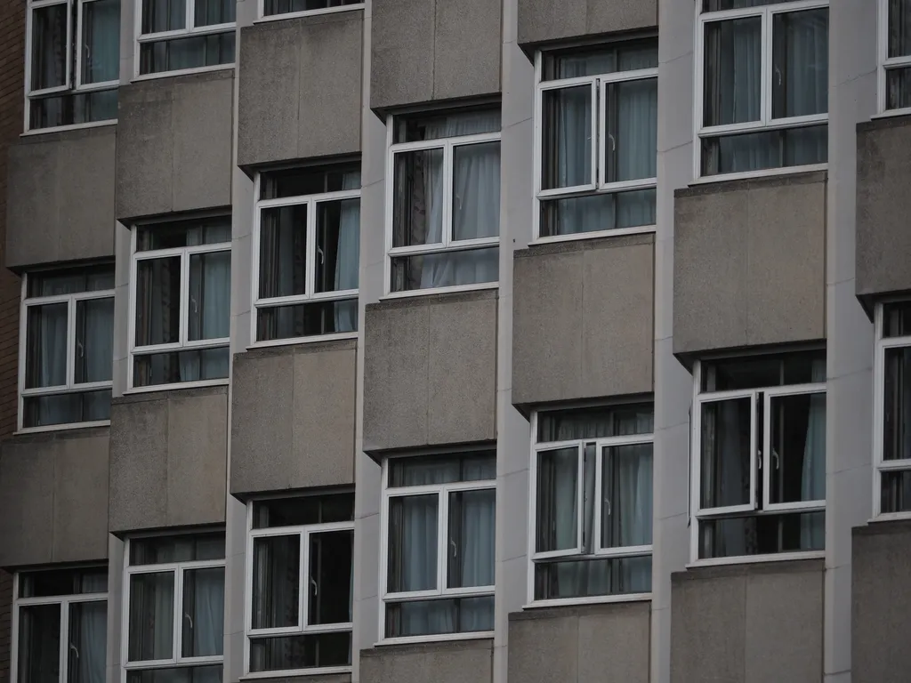 a concrete building with windows jutting out at 45º