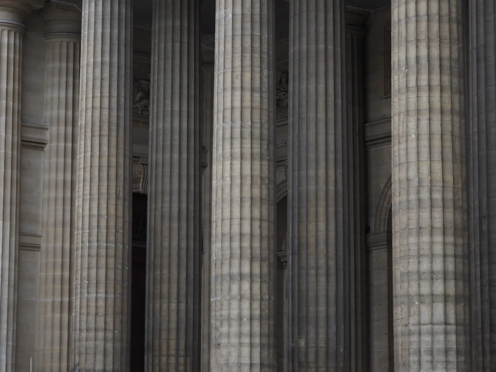 stone pillars in front of a church