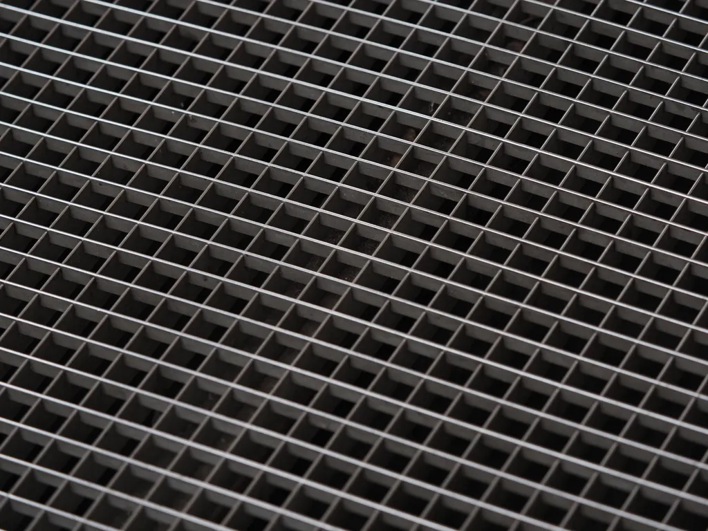 a metal grating above a subway