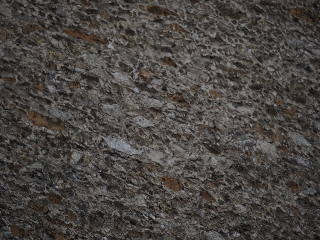 a textured stone wall on a building