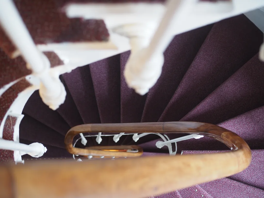 looking down a narrow spiral staircase