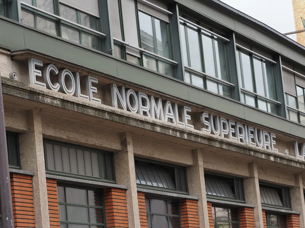 a sign on a school: ecole normale superieure