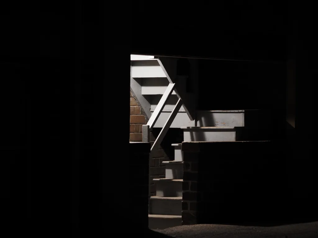 a stairwell lit up at night