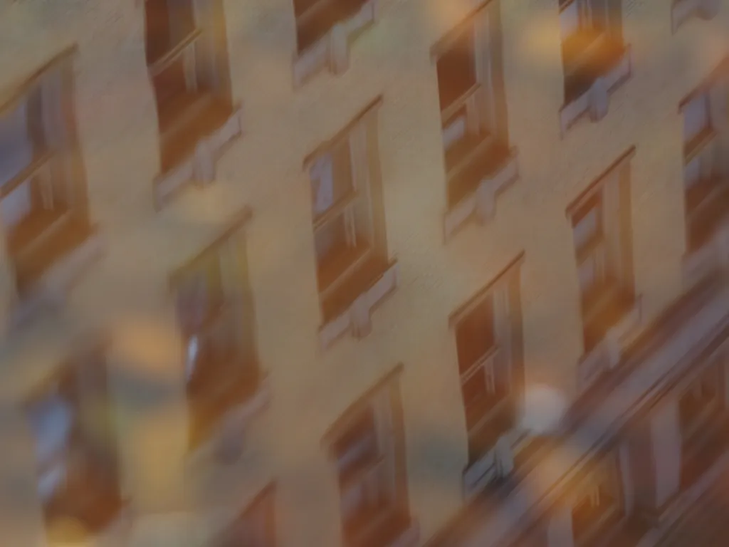 a building reflected in a puddle