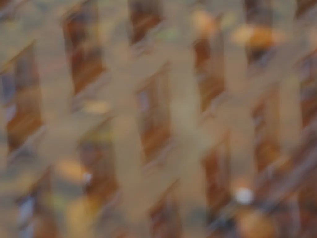 a building reflected in a puddle