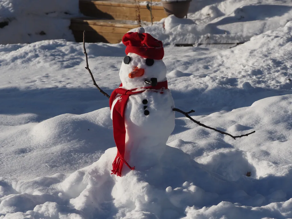 a snowman with pipe and scarf