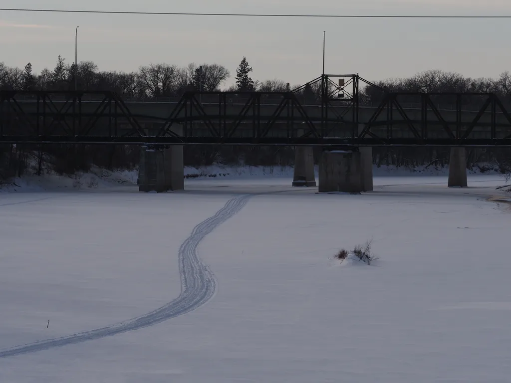 ski tracks on a frozen river