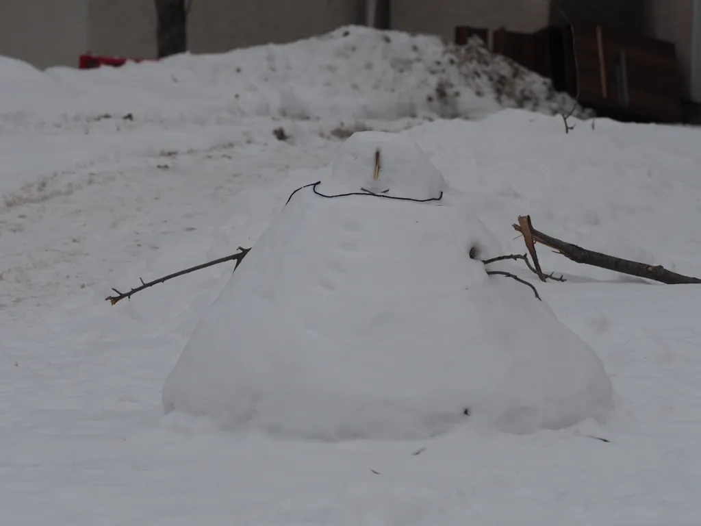 a wide triangular snowman