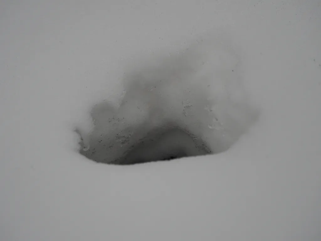 a hole in a snow drift