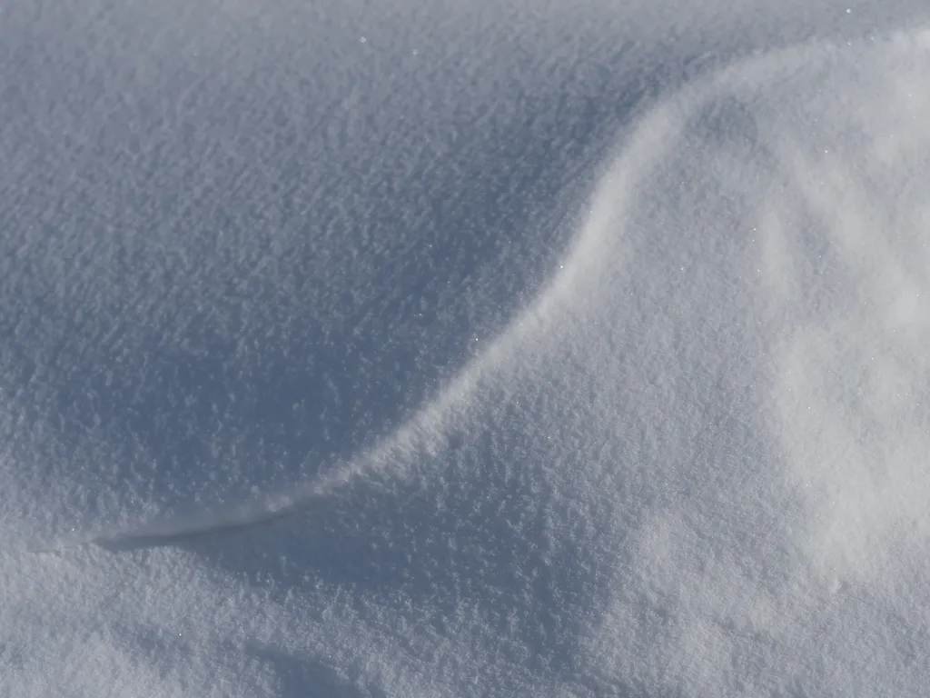 a curve in a snow drift