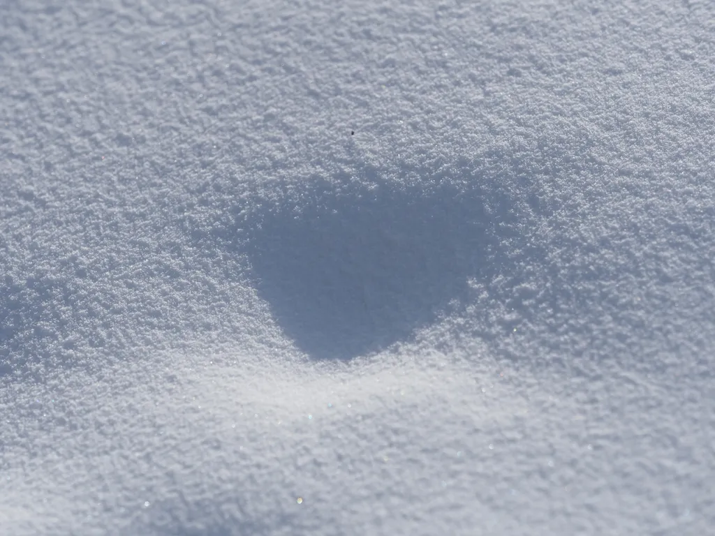 a divot in a snow drift