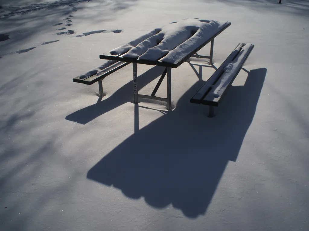 snow on a picnic table