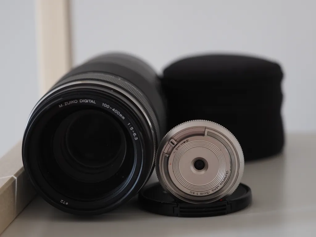 a huge and a tiny lens side-by-side