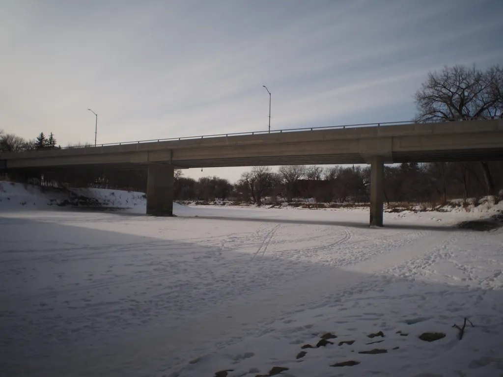 a bridge over a frozen river