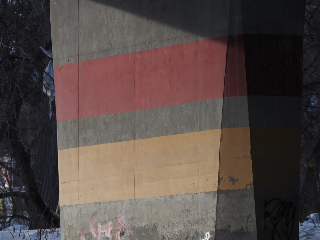 red and yellow stripes on a bridge