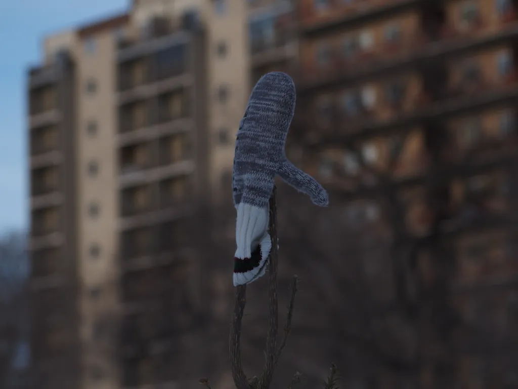 a mitten on top of a christmas tree