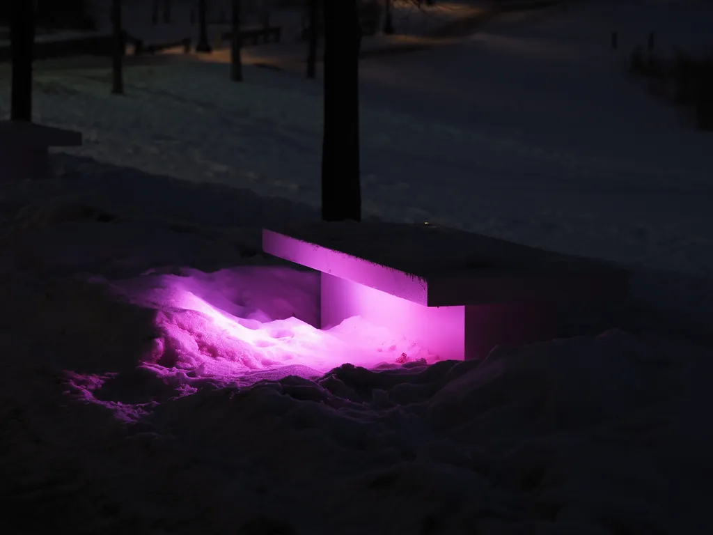 a bench lit up at night