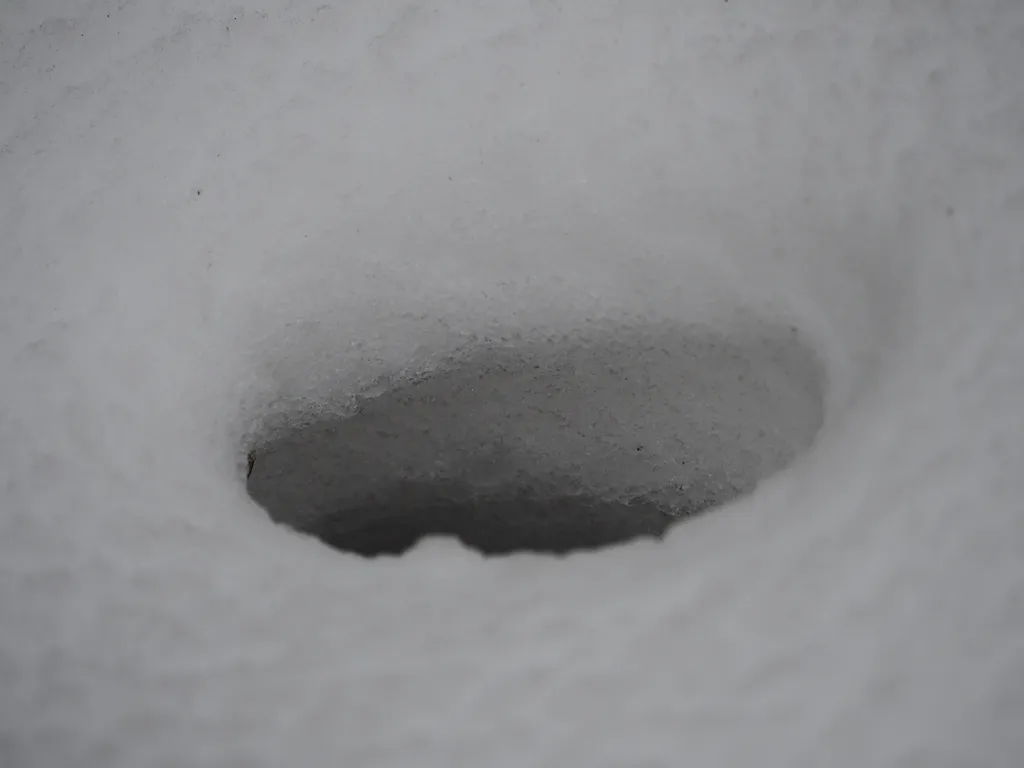 a hole in the snow