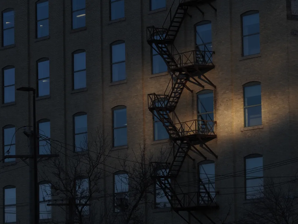 a beam of light on a fire escape