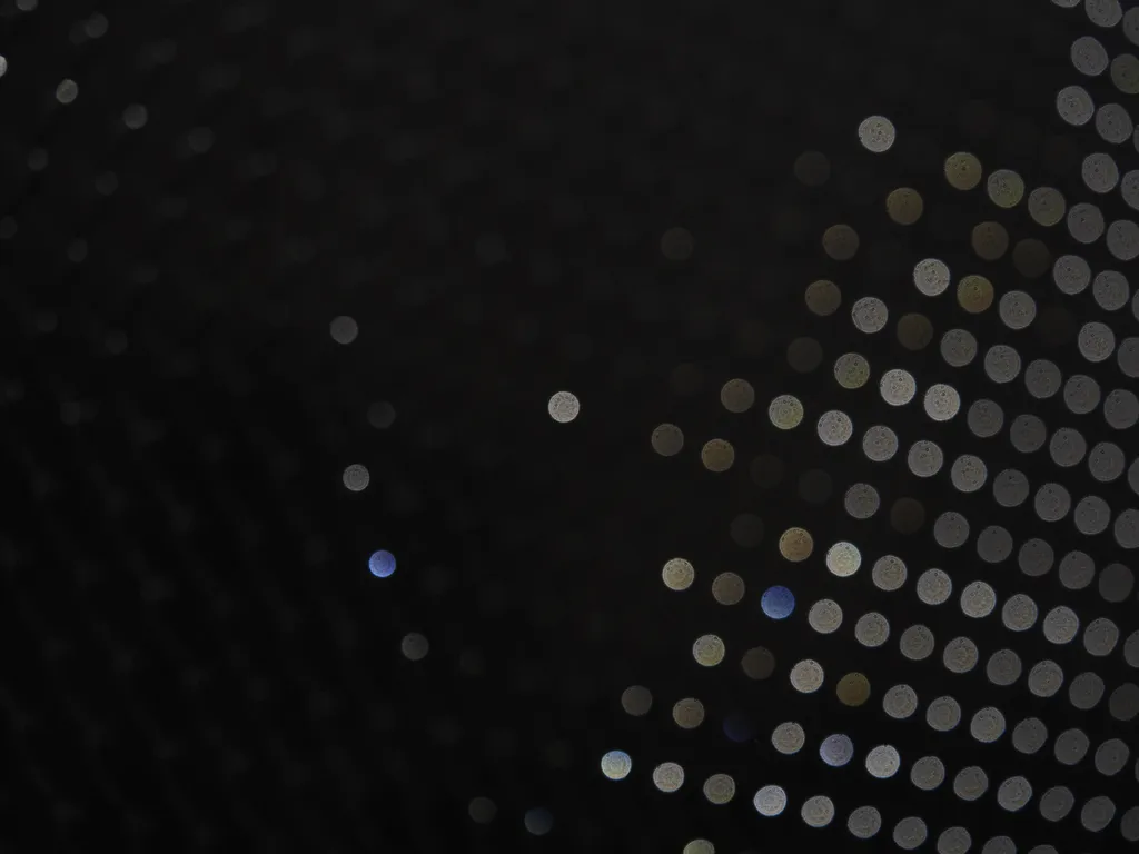 light on a chain-link fence