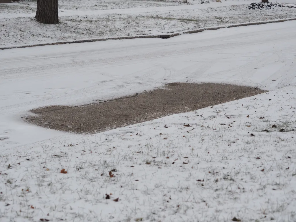 a bare spot where a car isn't