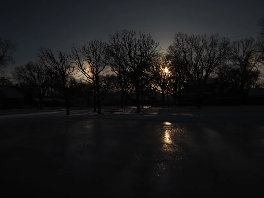 a sun dog reflecting on an outdoor rink