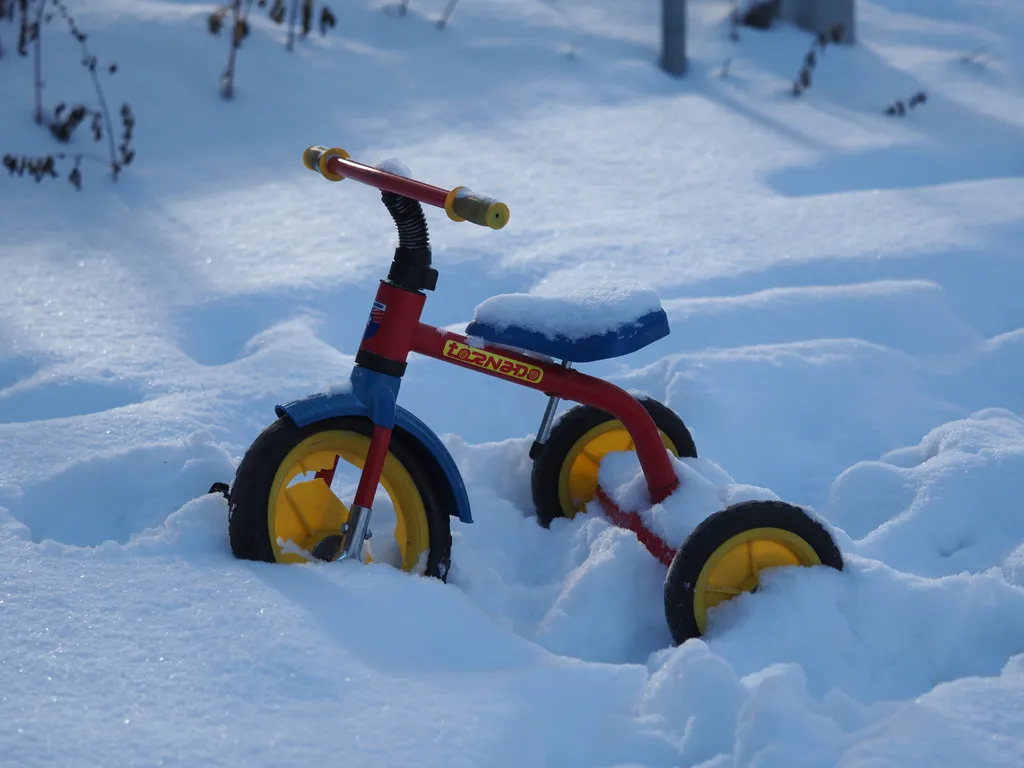a tricycle in the snow