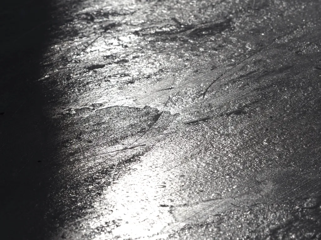 light reflecting off a frozen river