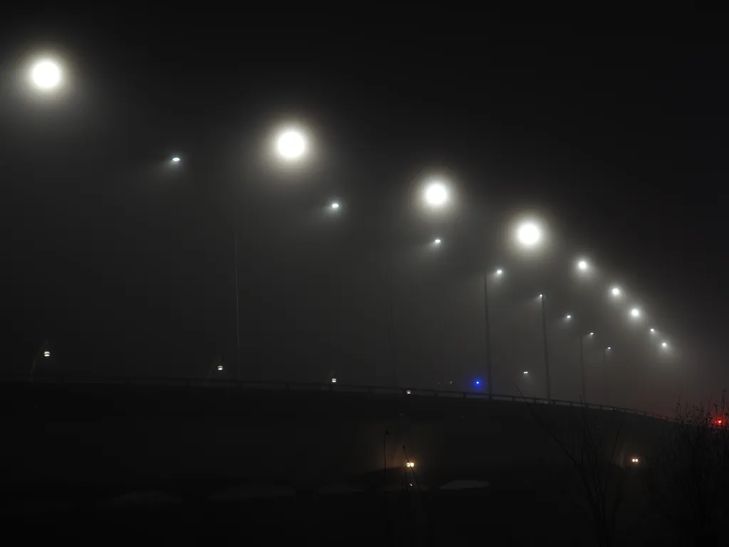 a bridge on a foggy night