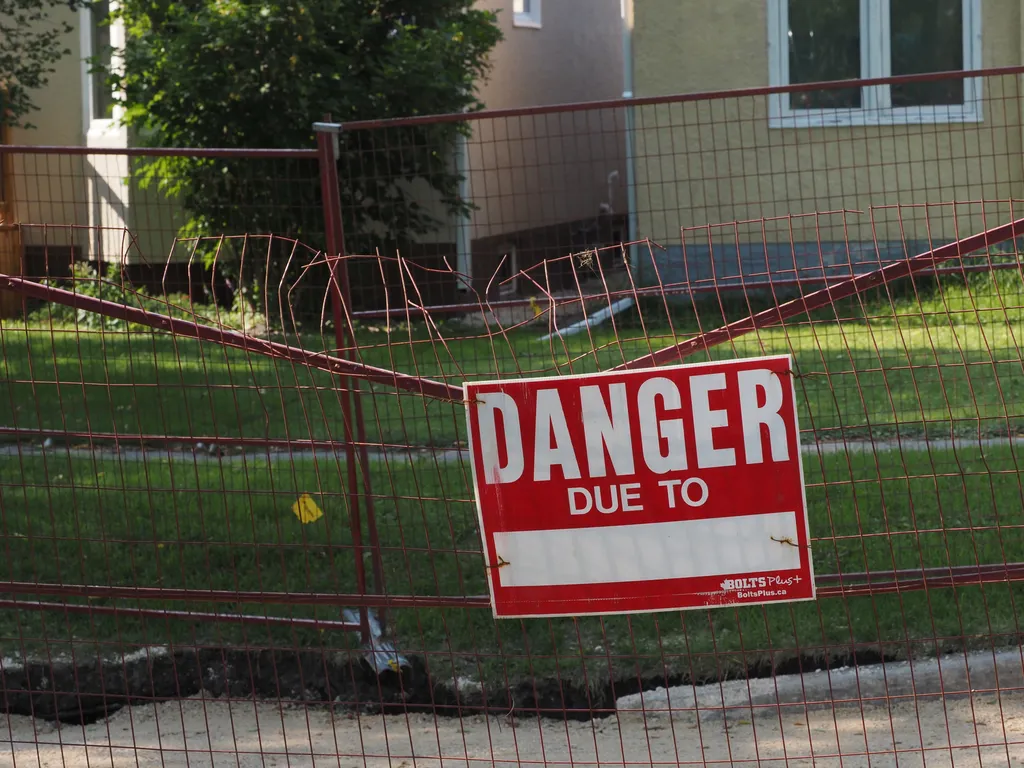 a sign on a fence 