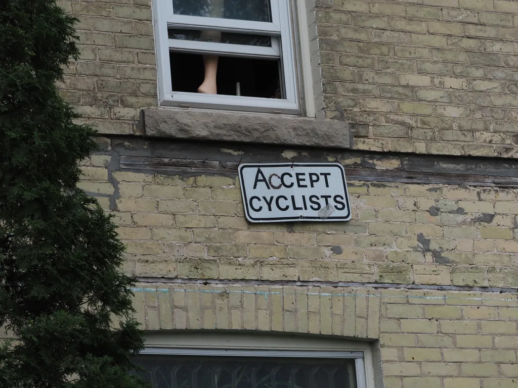 an 'except cyclists' sign that has been vandalized to say 'accept cyclists'